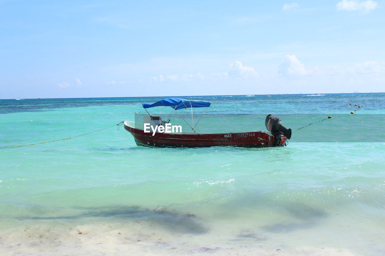 VIEW OF BOAT ON BEACH