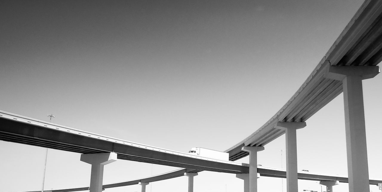 LOW ANGLE VIEW OF SUSPENSION BRIDGE AGAINST SKY