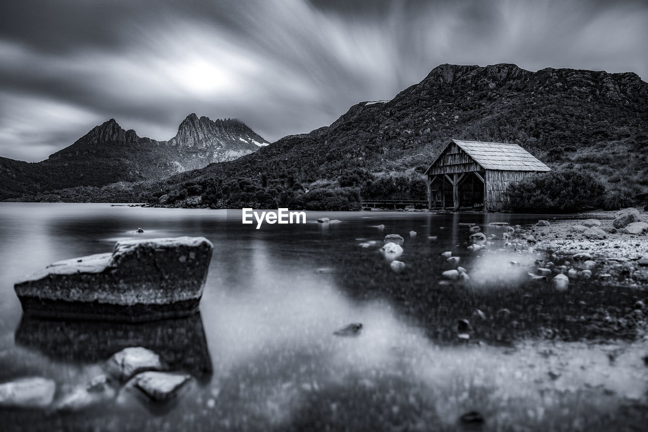 Scenic view of lake and mountains against sky