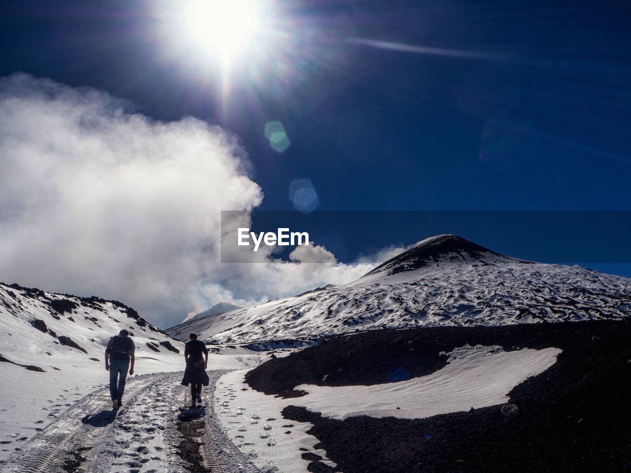 Scenic view of snow covered mountains against sky