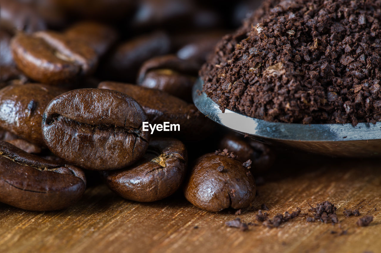 Close-up of roasted coffee beans on table