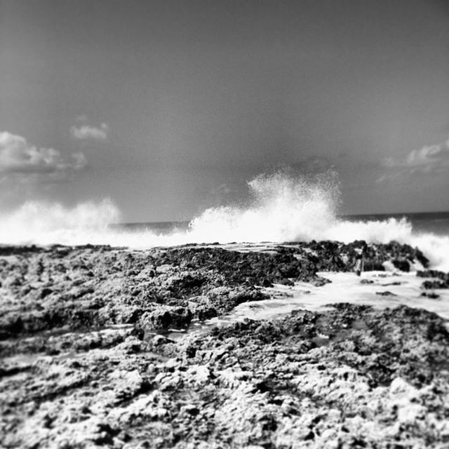 WAVES SPLASHING ON ROCKS AT SHORE