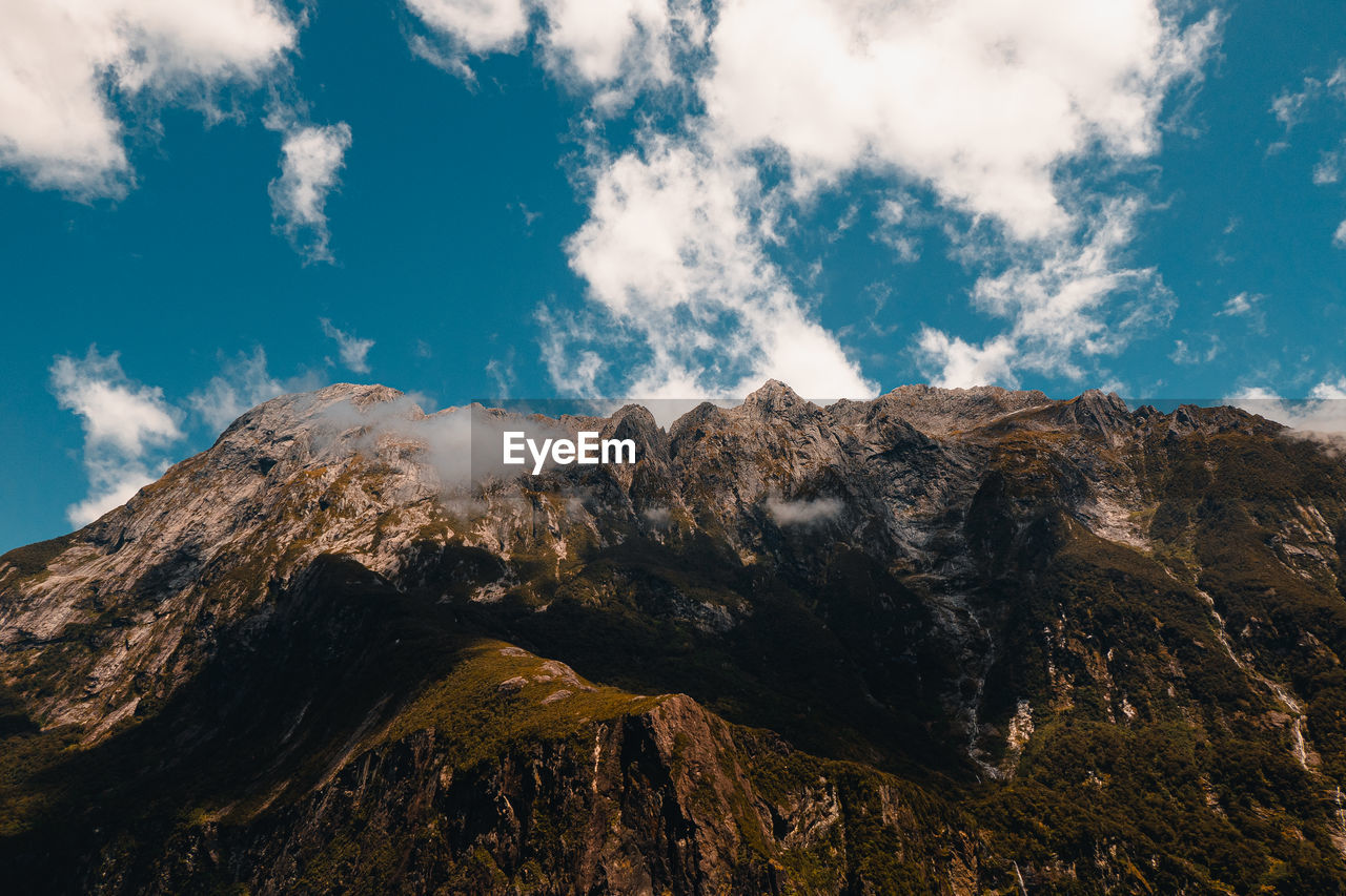 Low angle view of panoramic shot of mountains against sky