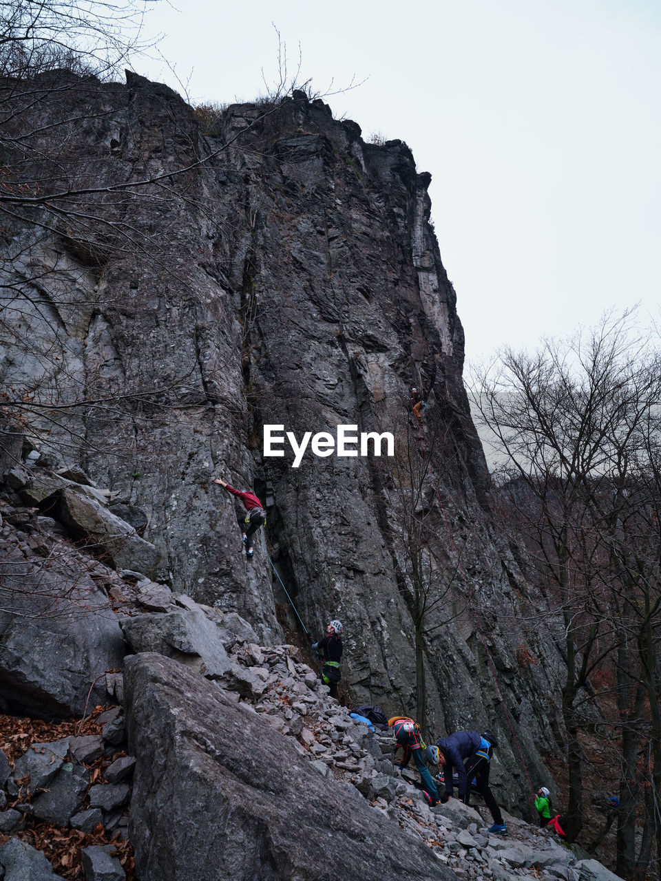 A group of young climbers climb together on a rock, Hradok pod Vtacnikom, Slovakia Rock High Low Angle View Danger Safe Rope Friend Secure Climb Climber Climbers Activity Sport Outdoors Day Sky Group