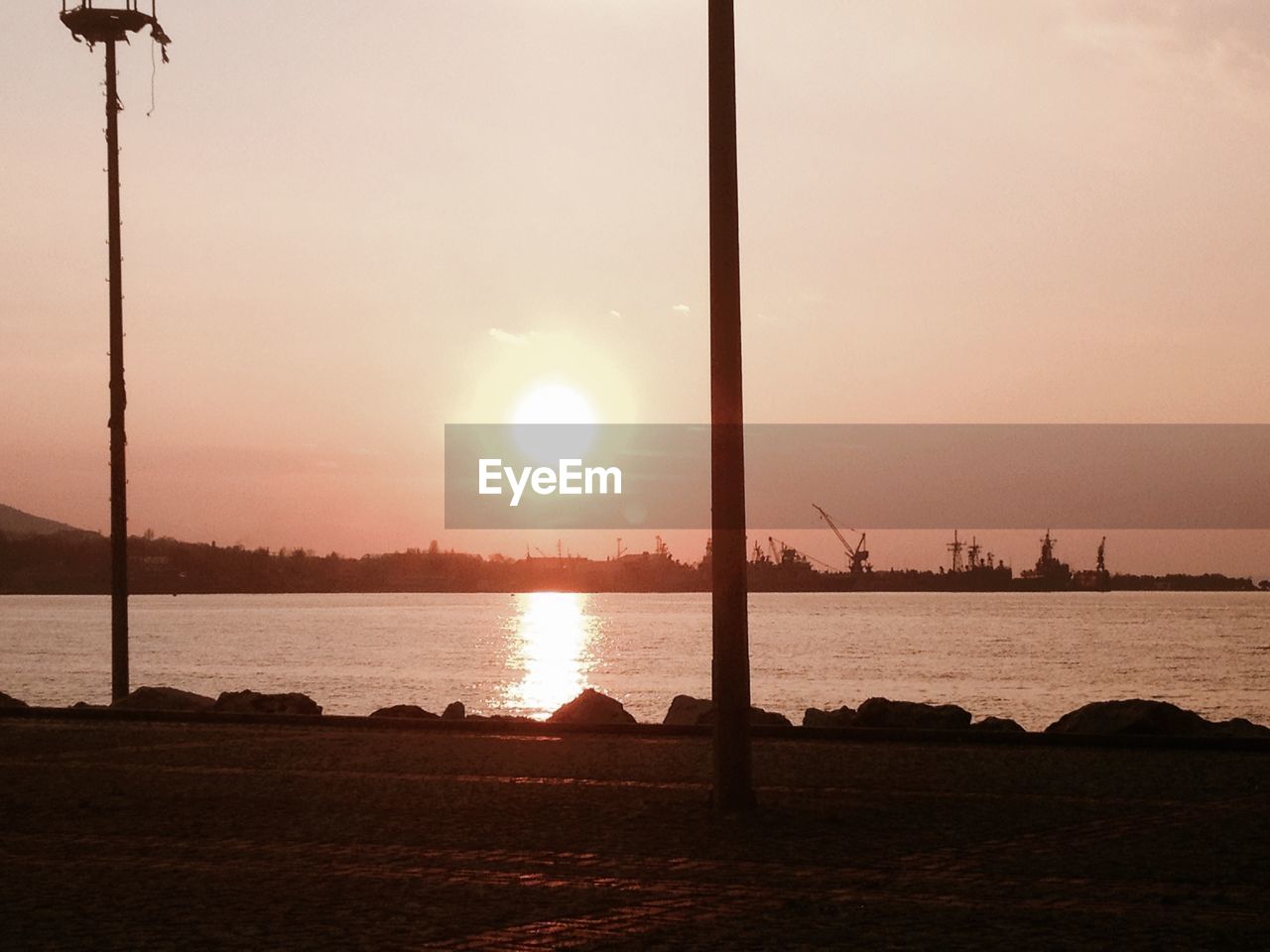 View of calm lake at sunset