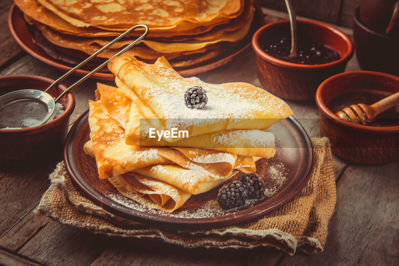 food and drink, food, fast food, dish, meal, no people, freshness, breakfast, baked, bowl, sweet food, healthy eating, table, indoors, high angle view, cuisine, wellbeing, still life, fruit, plate, asian food, wood, dessert