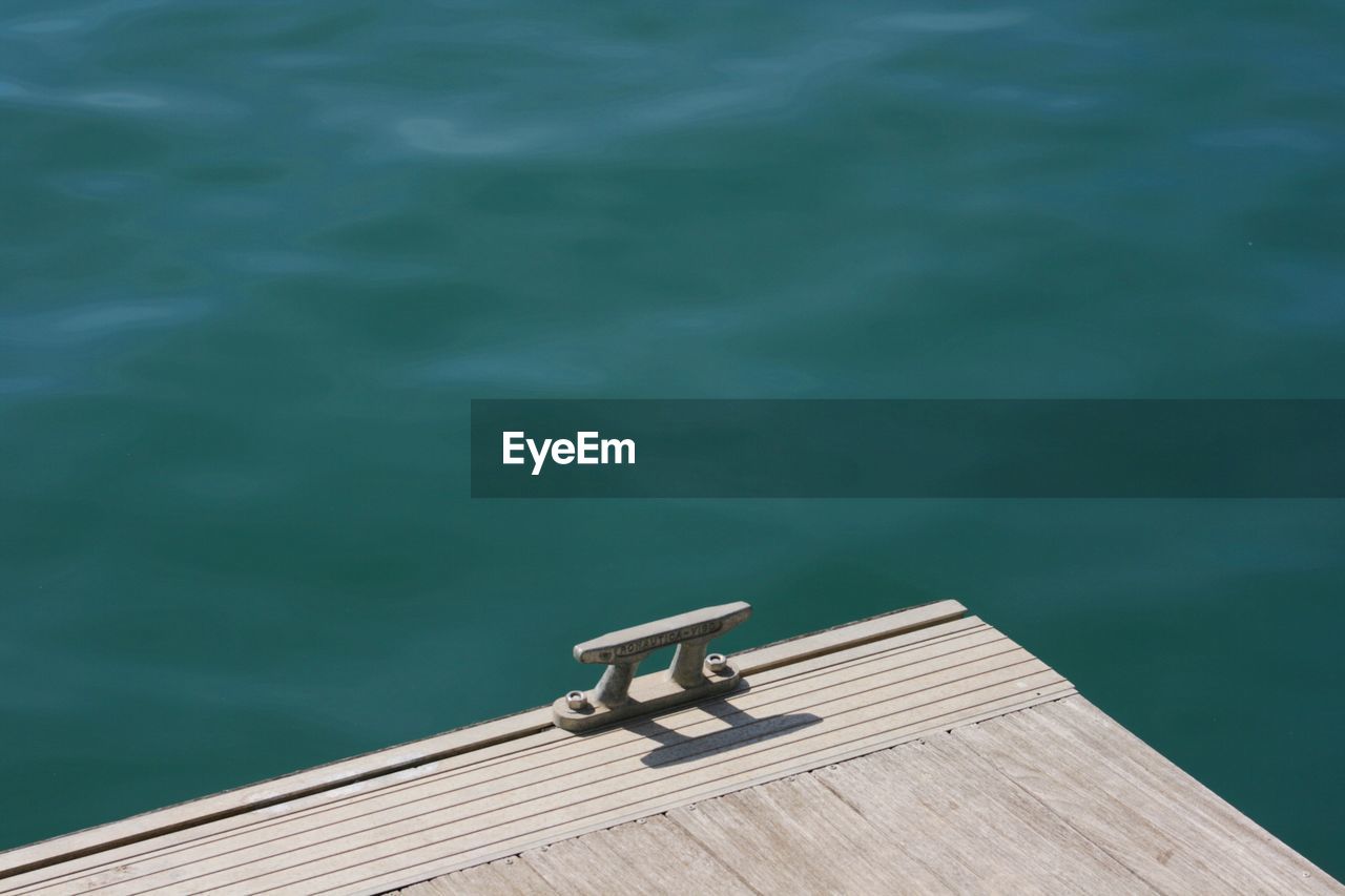 High angle view of pier corner against lake