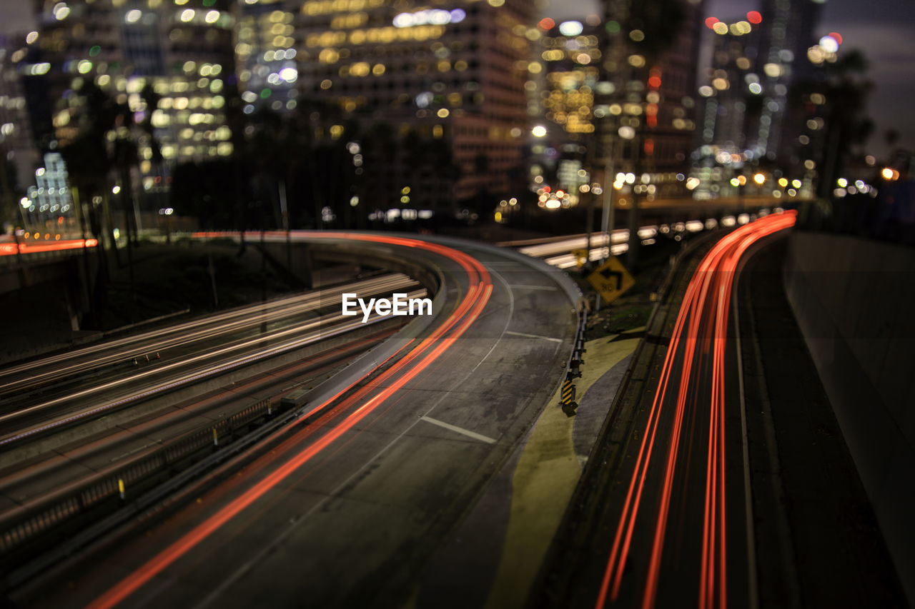 Light trails on road in city at night