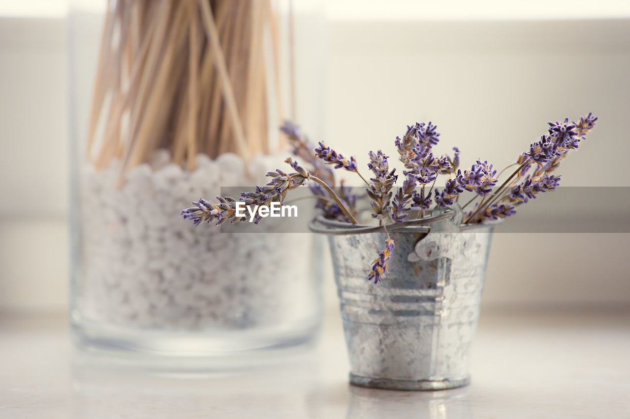 Close-up of flower vase on table