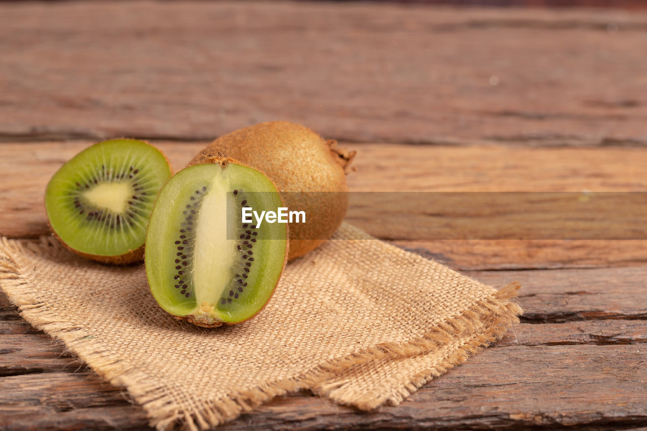 A half of kiwi placed on the brown sack