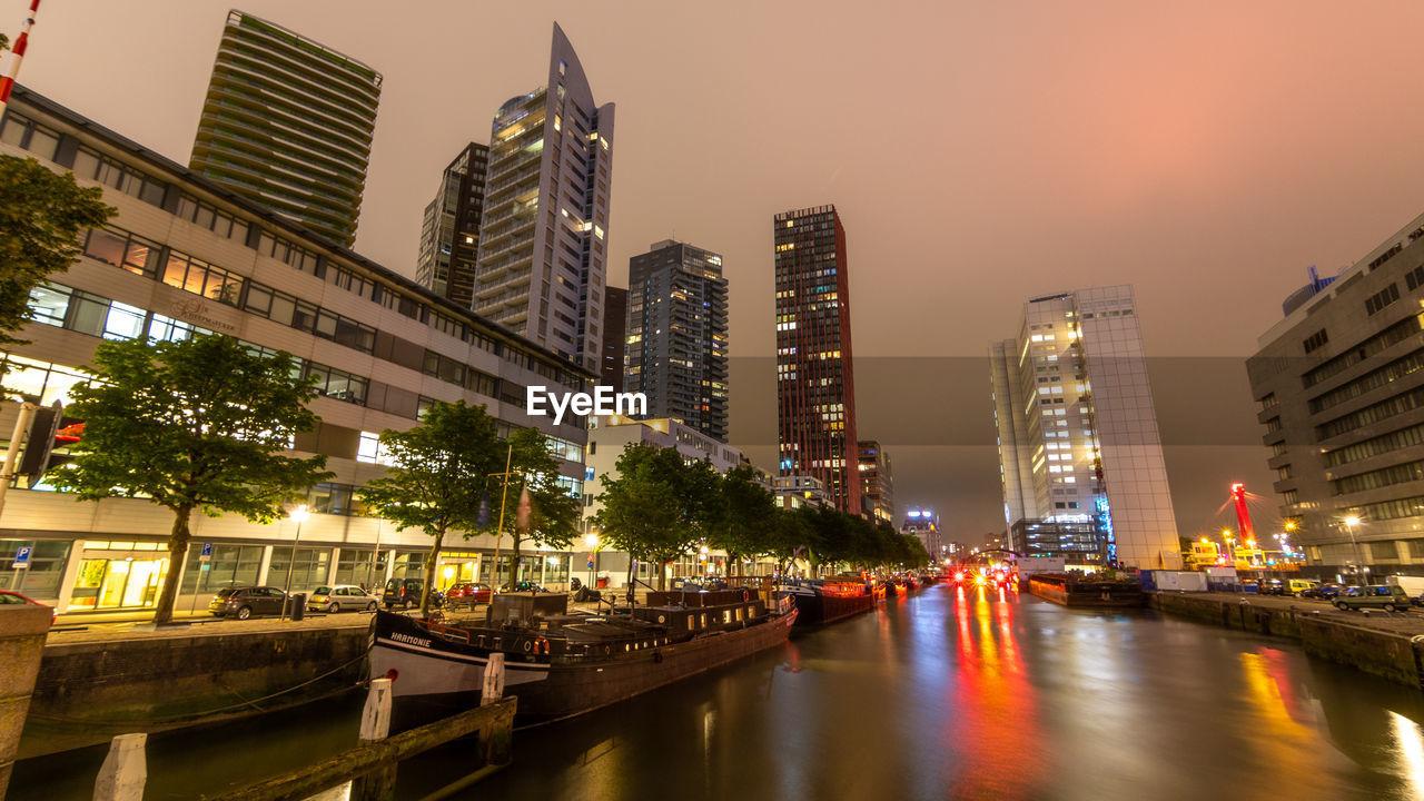 Illuminated buildings in city at night