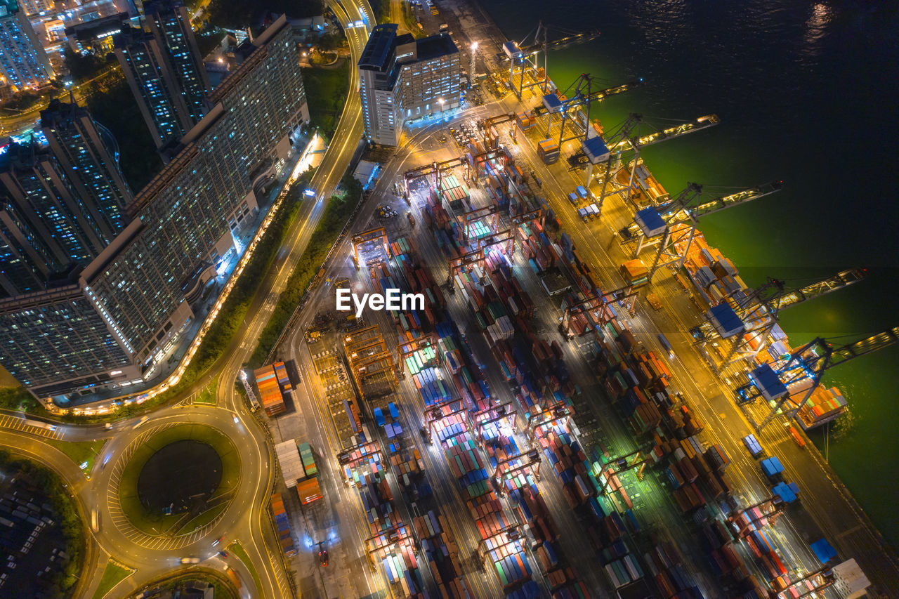 High angle view of city lit up at night