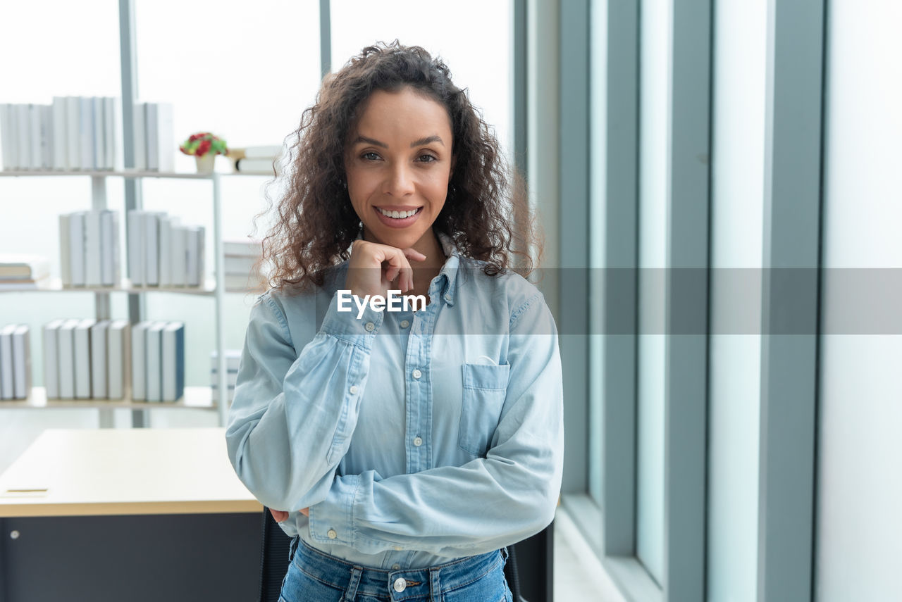 Portrait of young businesswoman in office