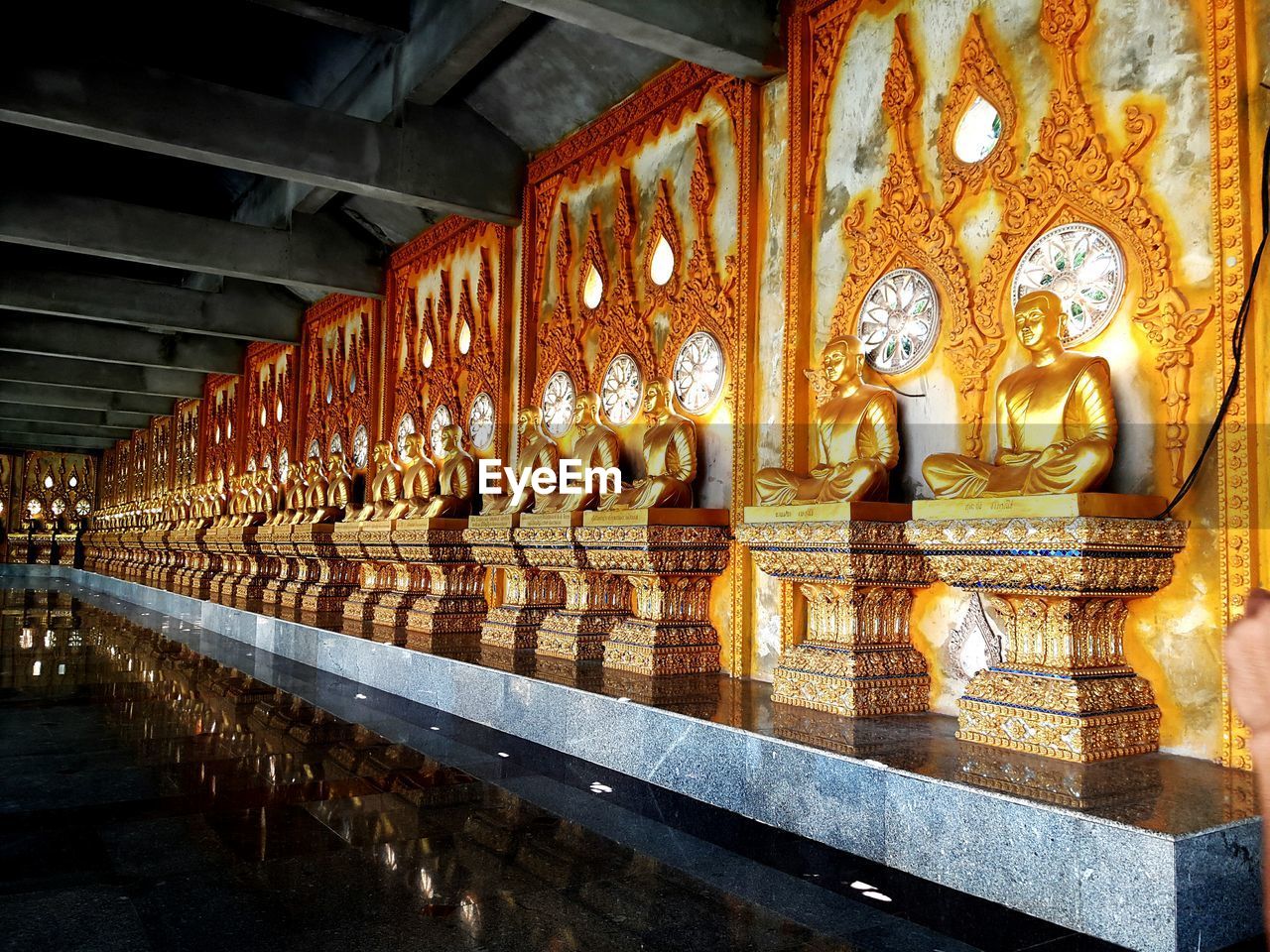 STATUE IN TEMPLE SEEN FROM CORRIDOR