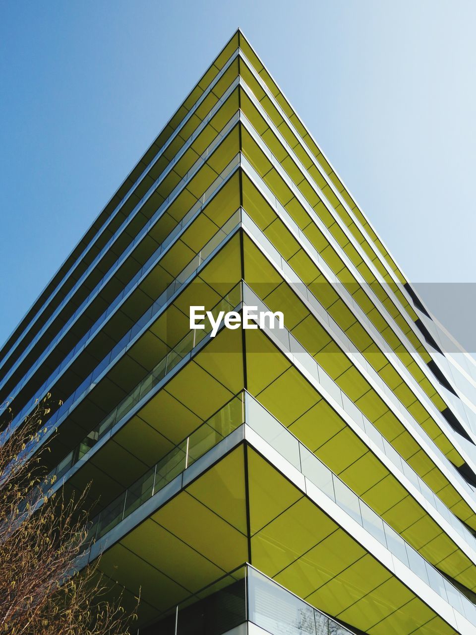 Low angle view of modern building against clear sky