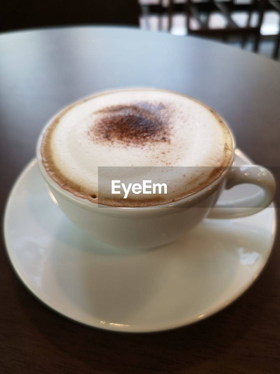 COFFEE CUP ON TABLE