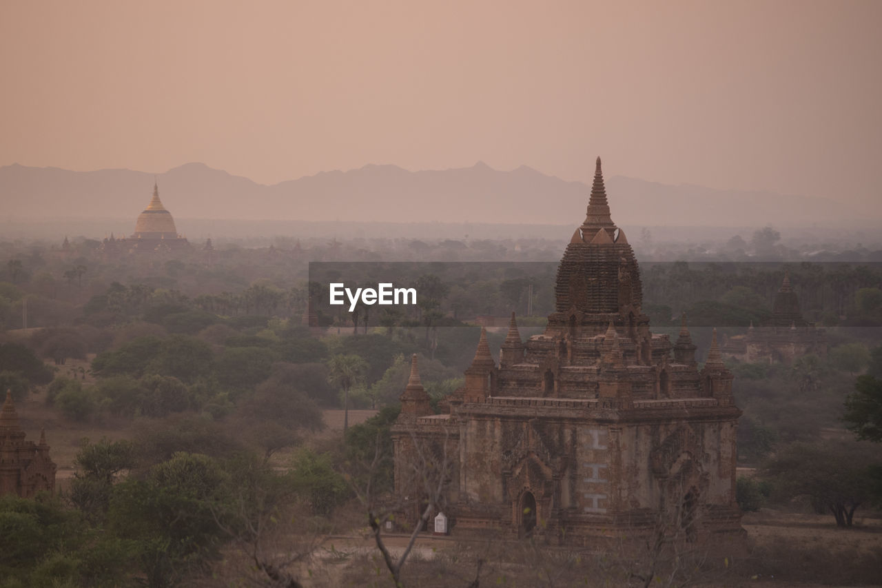 Historic temple against sky during sunset