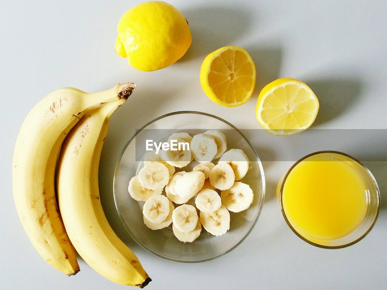 Directly above shot of bananas and lemon on table