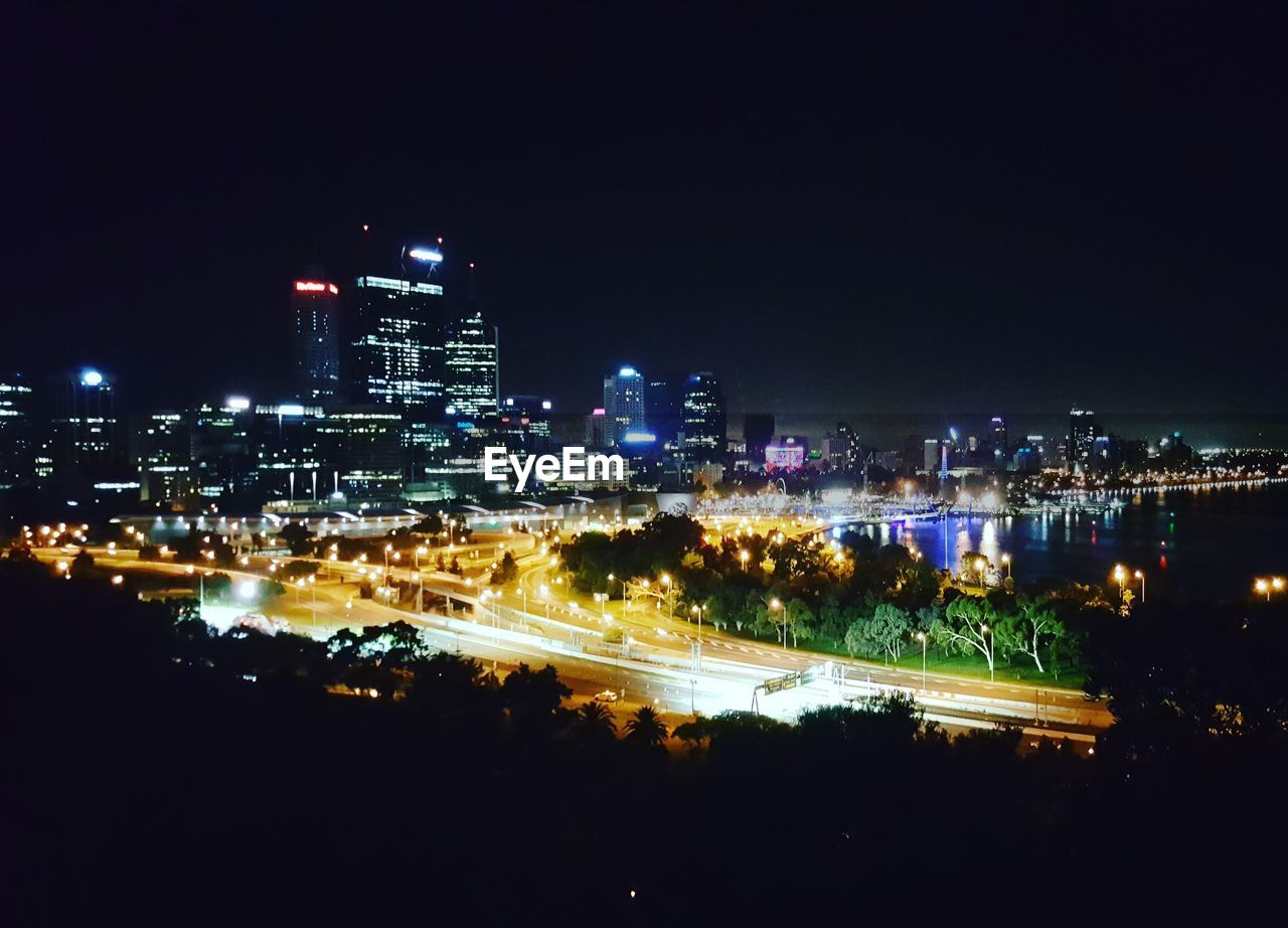 ILLUMINATED CITYSCAPE AT NIGHT