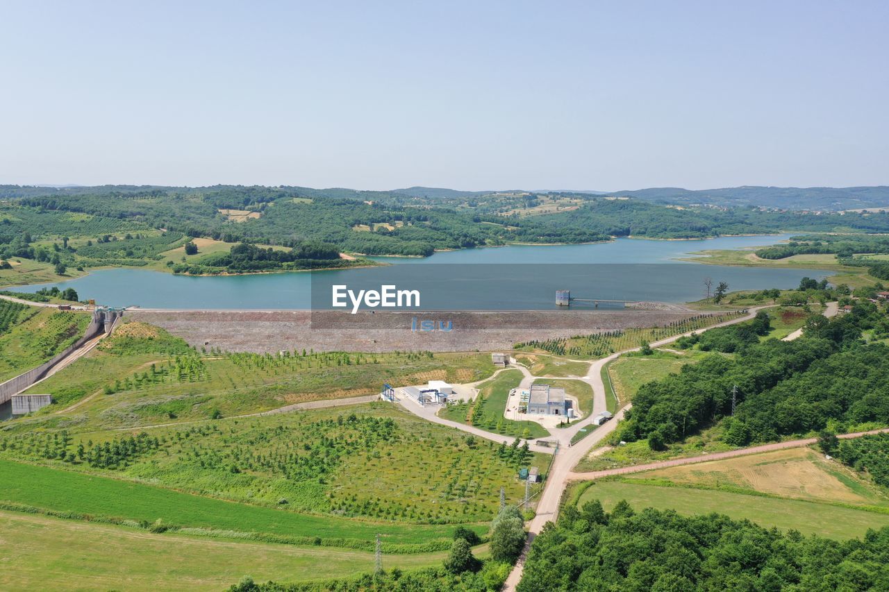 HIGH ANGLE VIEW OF TREES ON LANDSCAPE AGAINST SKY