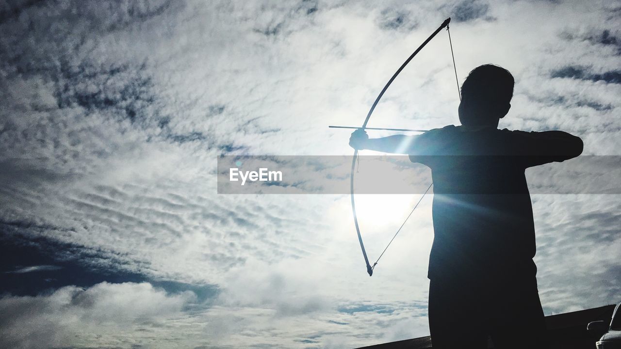 Low angle view of man against sky