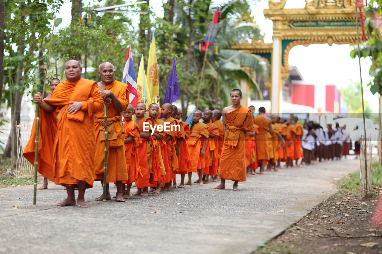 GROUP OF PEOPLE WALKING ON TEMPLE