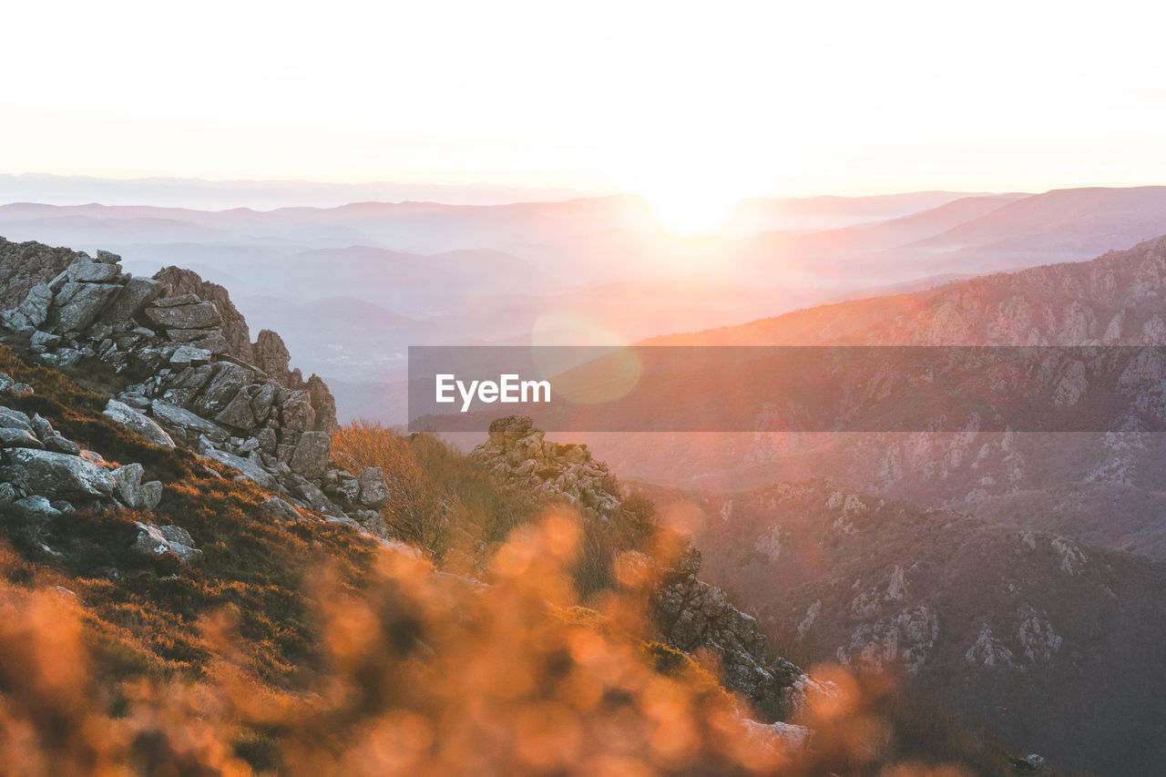 Scenic view of mountains against sky during sunset