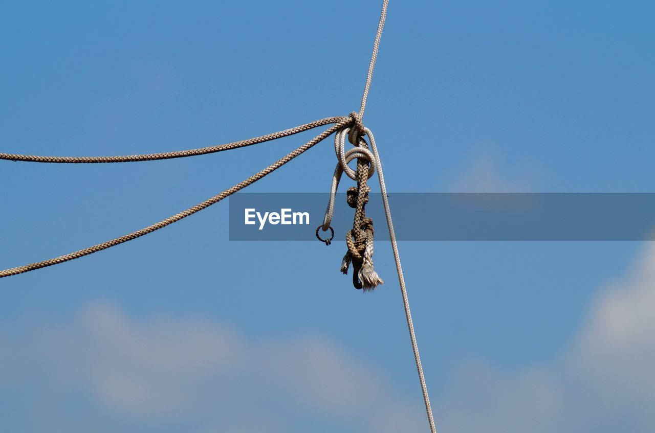 LOW ANGLE VIEW OF CHAIN AGAINST SKY