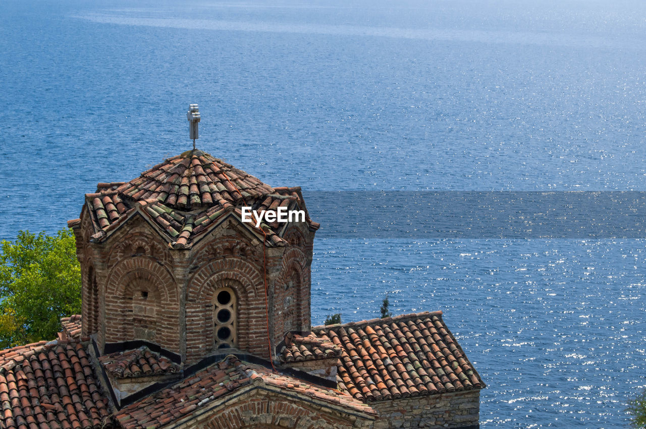 SCENIC VIEW OF SEA WITH BUILDINGS IN BACKGROUND