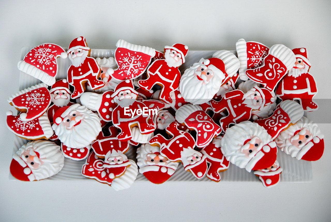 Close-up of santa claus cookies over white background