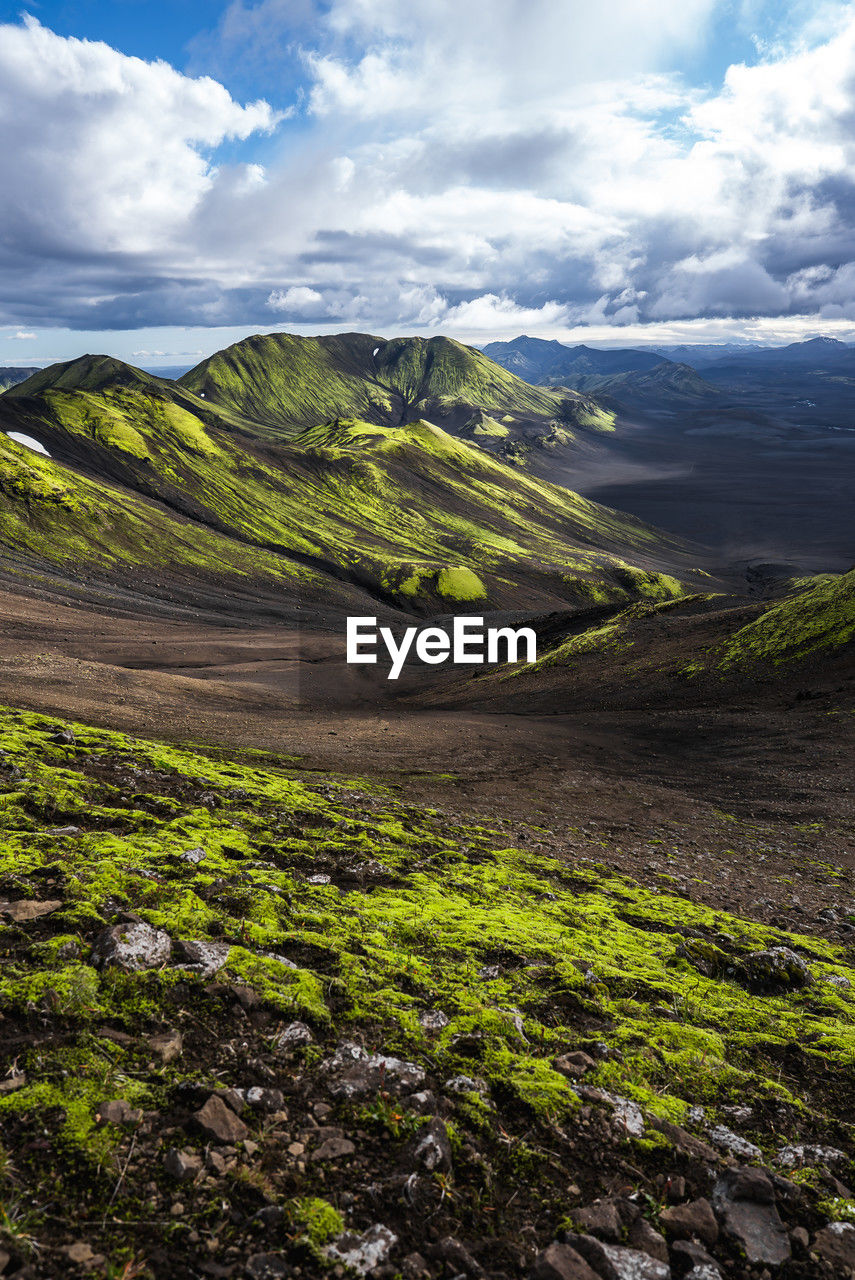 scenic view of landscape against cloudy sky