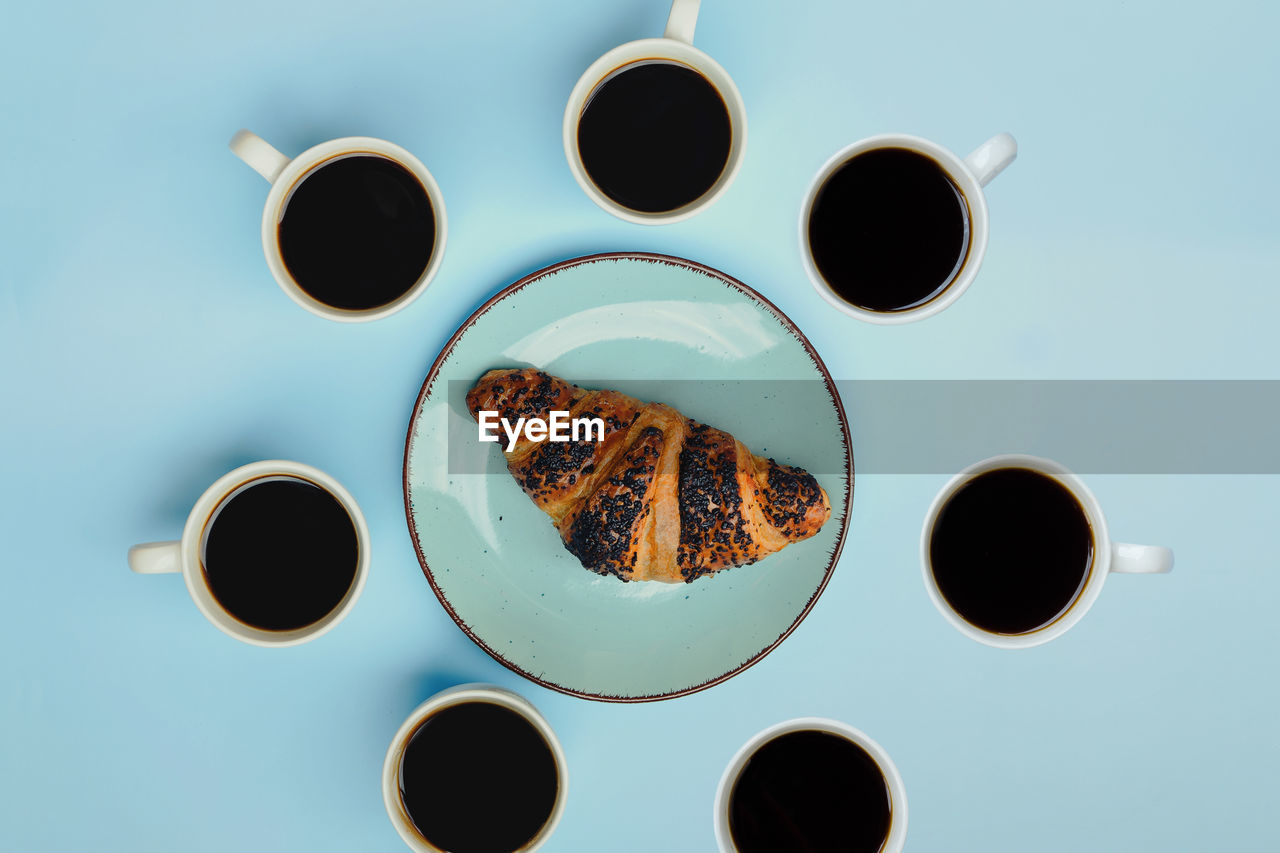 Directly above shot of coffee cups on table