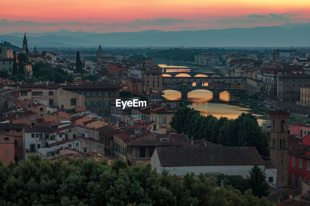 Panorama of the city at sunset, view from piazzale michelangelo to river arno with numerous bridges