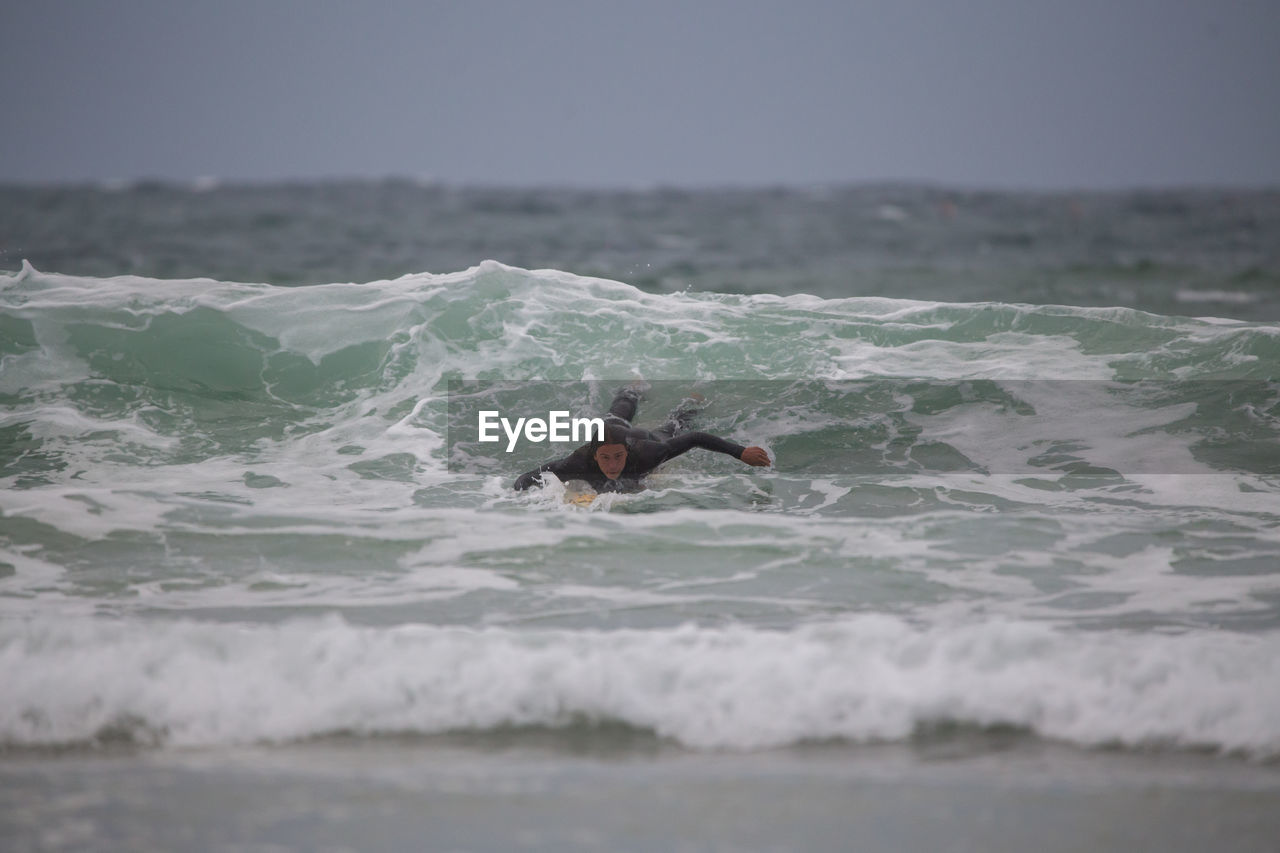 Man surfing in sea