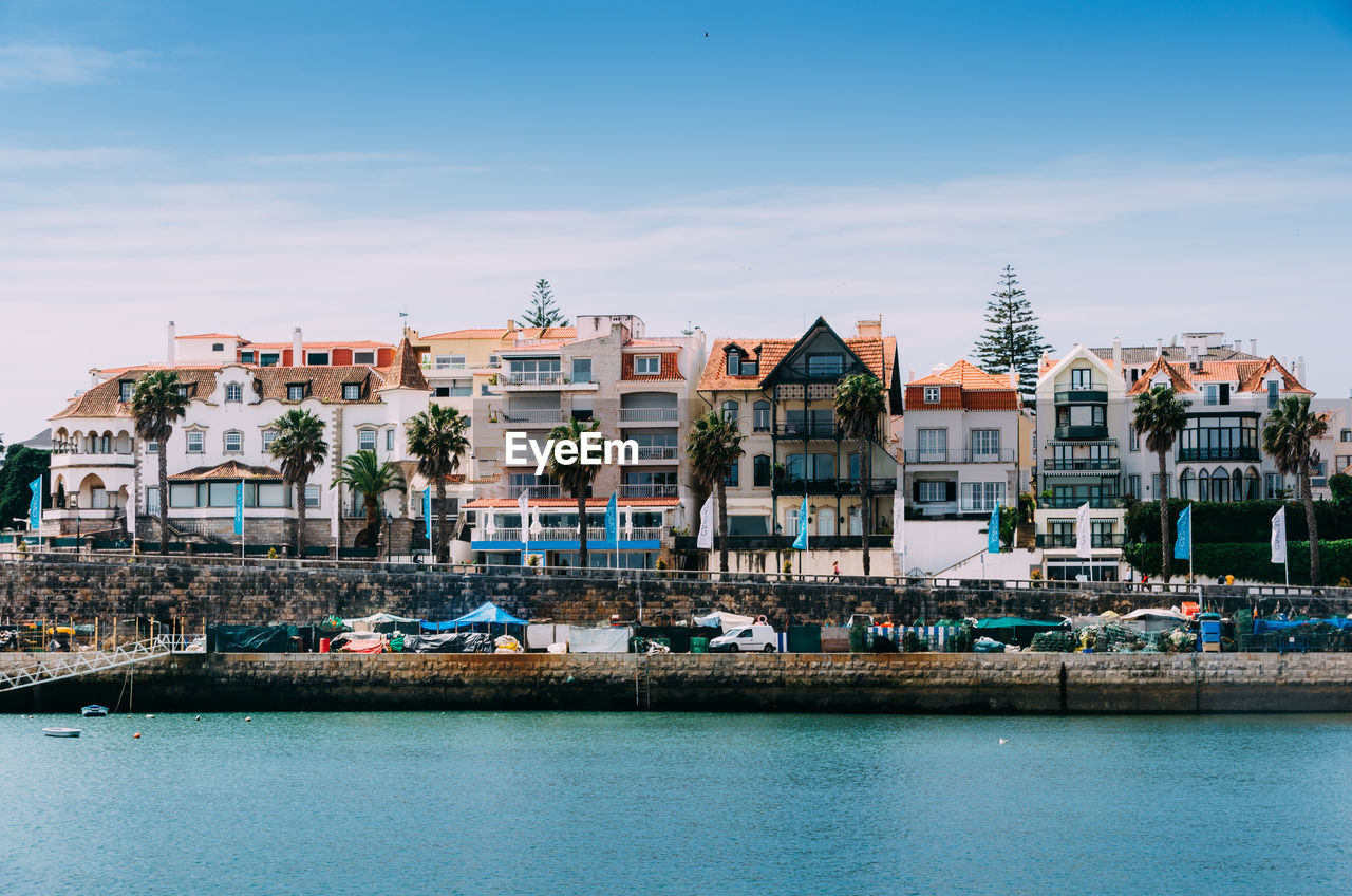 View of the beautiful cascais bay with traditional residential buildings next to the famous bay