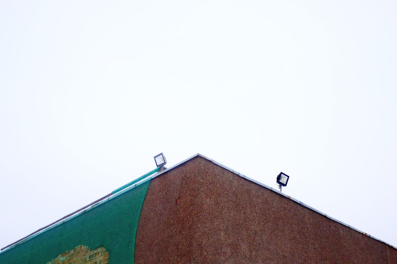 Low angle view of roof against clear sky