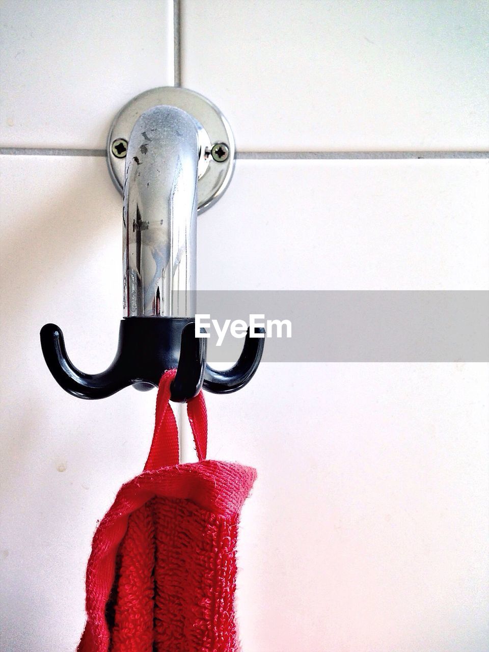 Close-up of towel hanging on bathroom hook