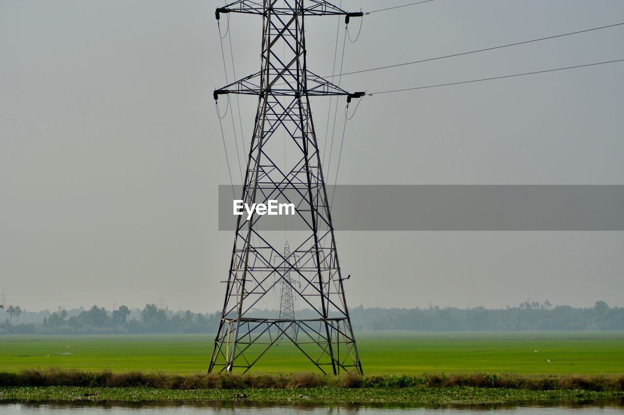 ELECTRICITY PYLON ON FIELD