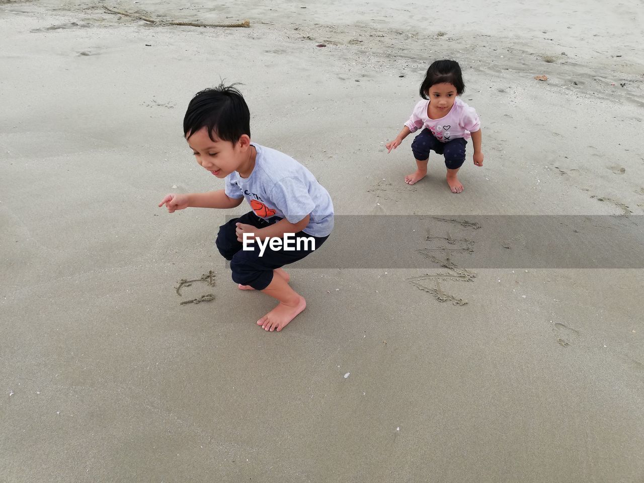 High angle view of two children at beach