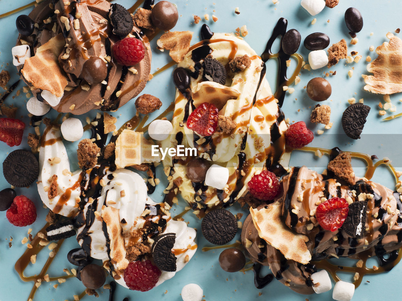 Fruit and ice cream dessert with chocolate sauce and cookies