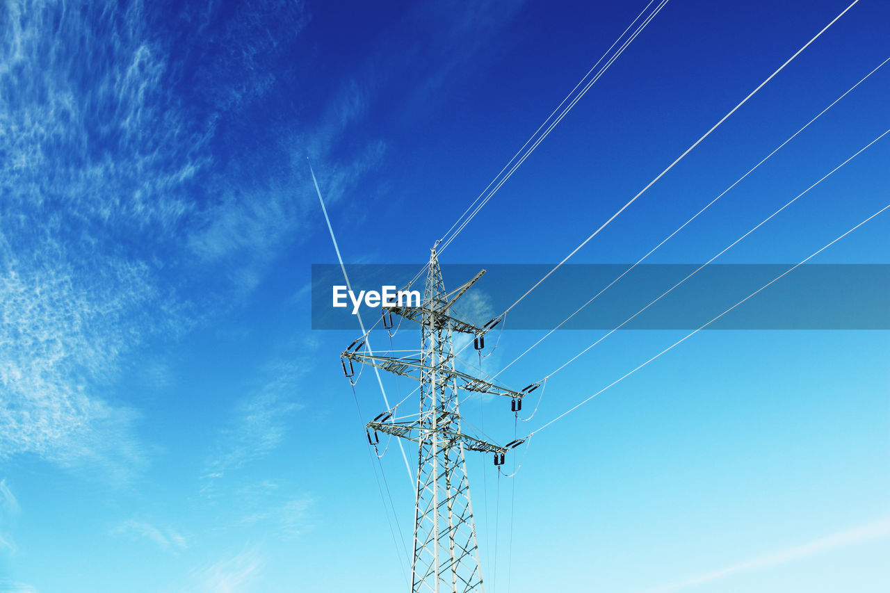 LOW ANGLE VIEW OF POWER LINES AGAINST BLUE SKY