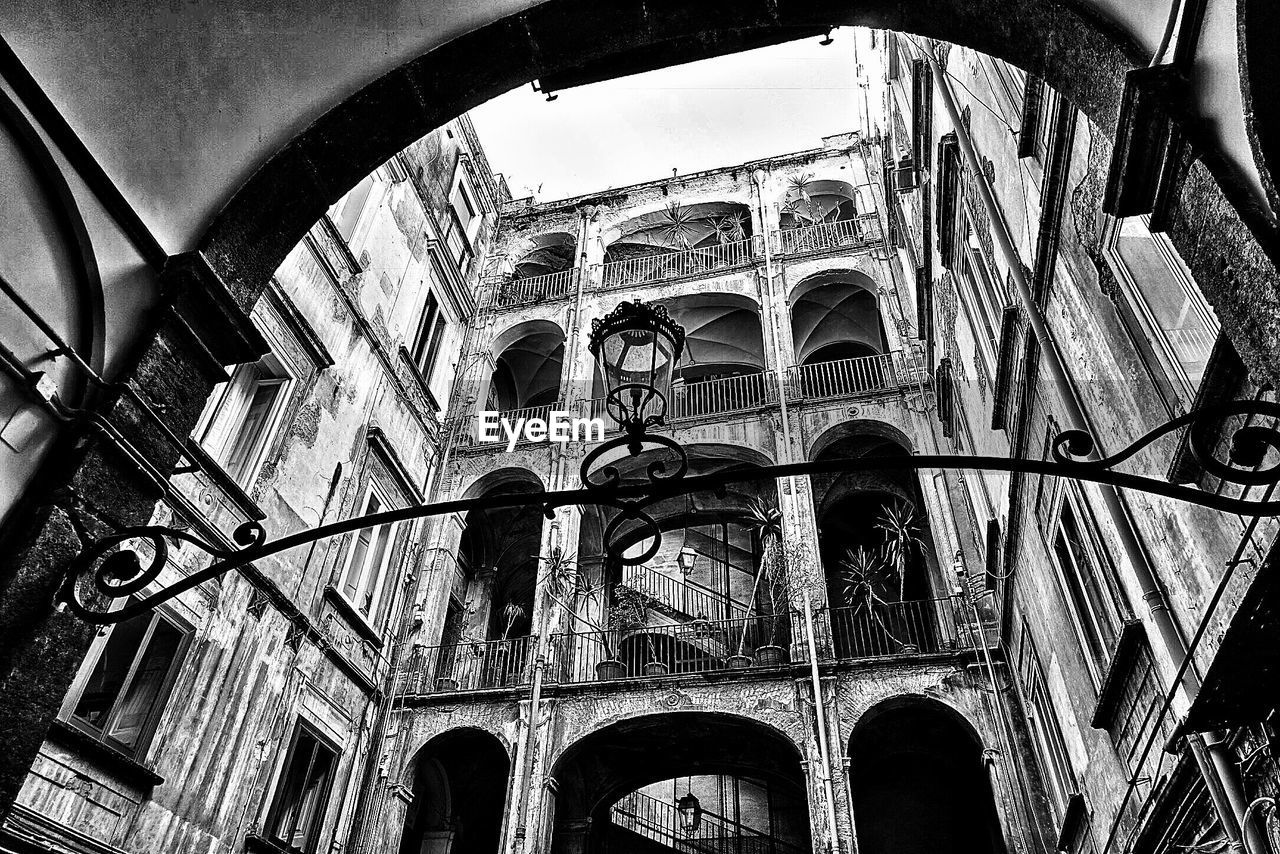 LOW ANGLE VIEW OF BUILT STRUCTURES AGAINST SKY