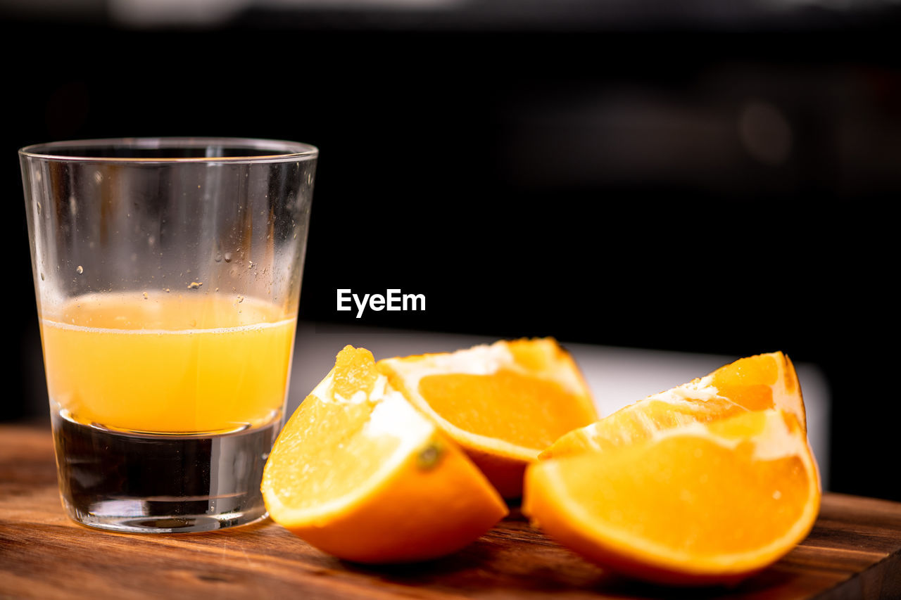 CLOSE-UP OF ORANGE JUICE IN GLASS