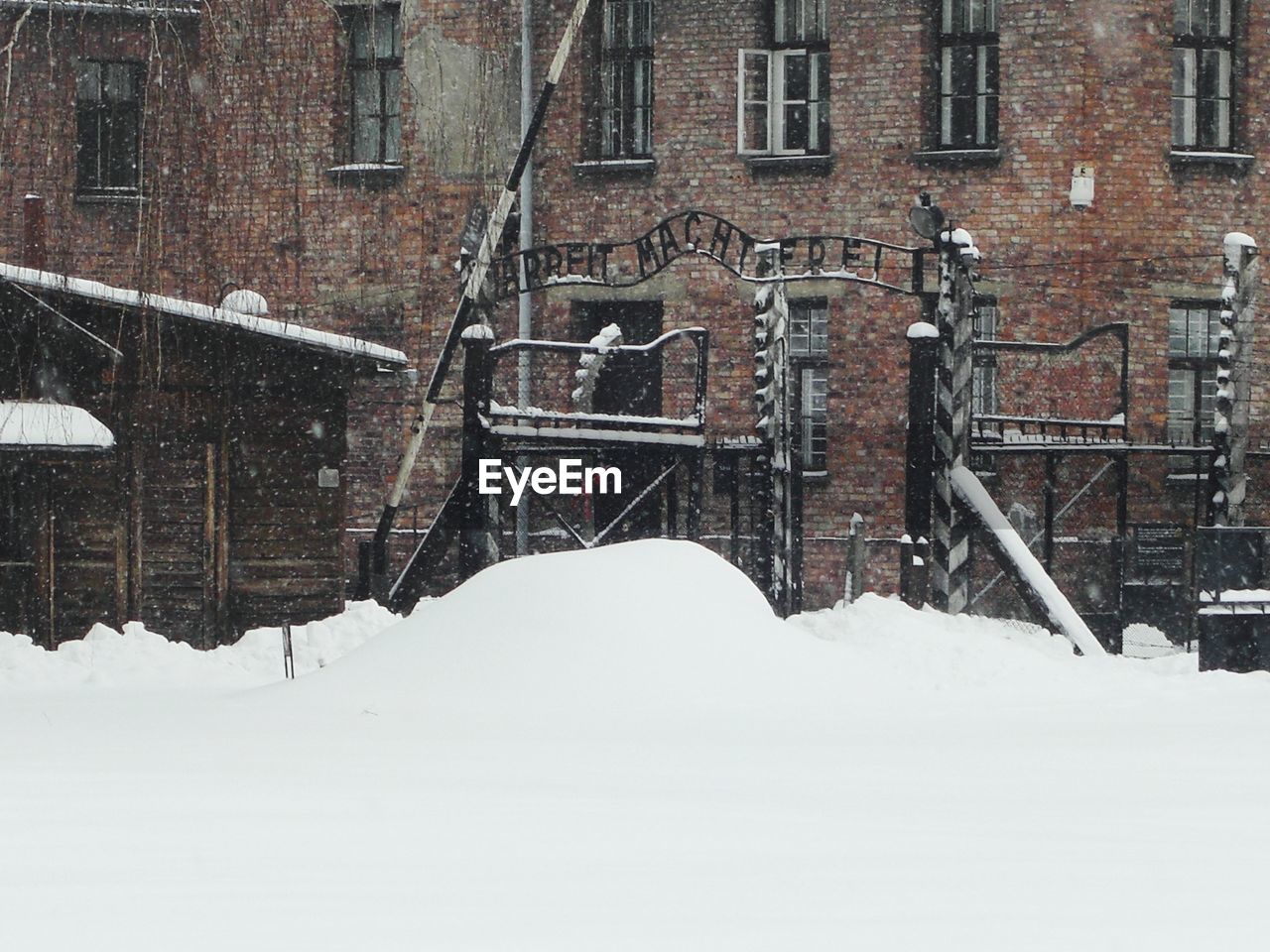 Entrance to auschwitz in the snow 
