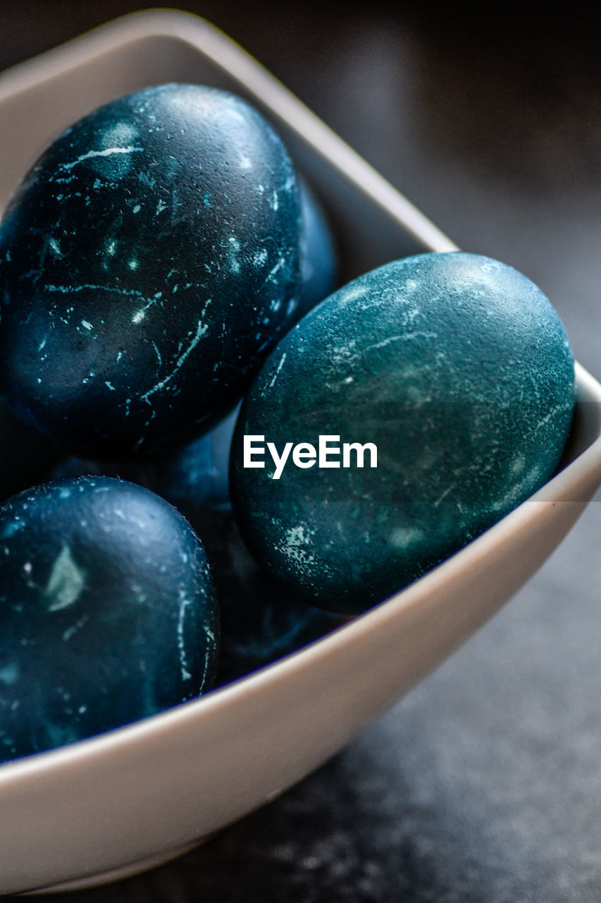 Close-up of blue eggs in plate