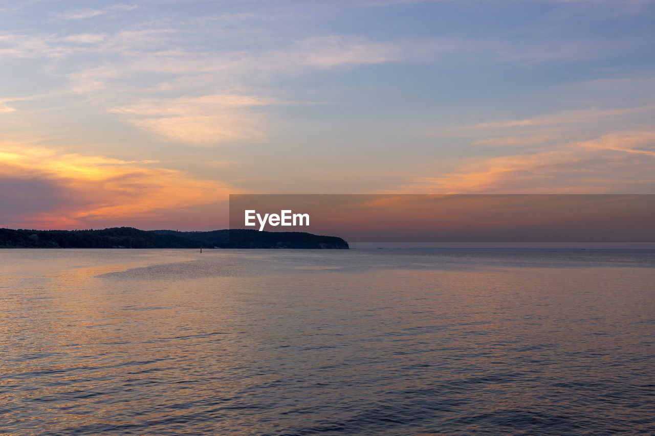 SCENIC VIEW OF SEA DURING SUNSET