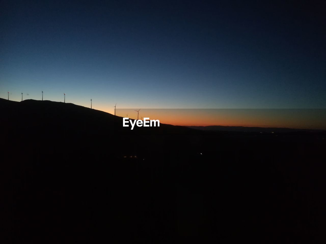 SILHOUETTE LANDSCAPE AGAINST SKY DURING SUNSET