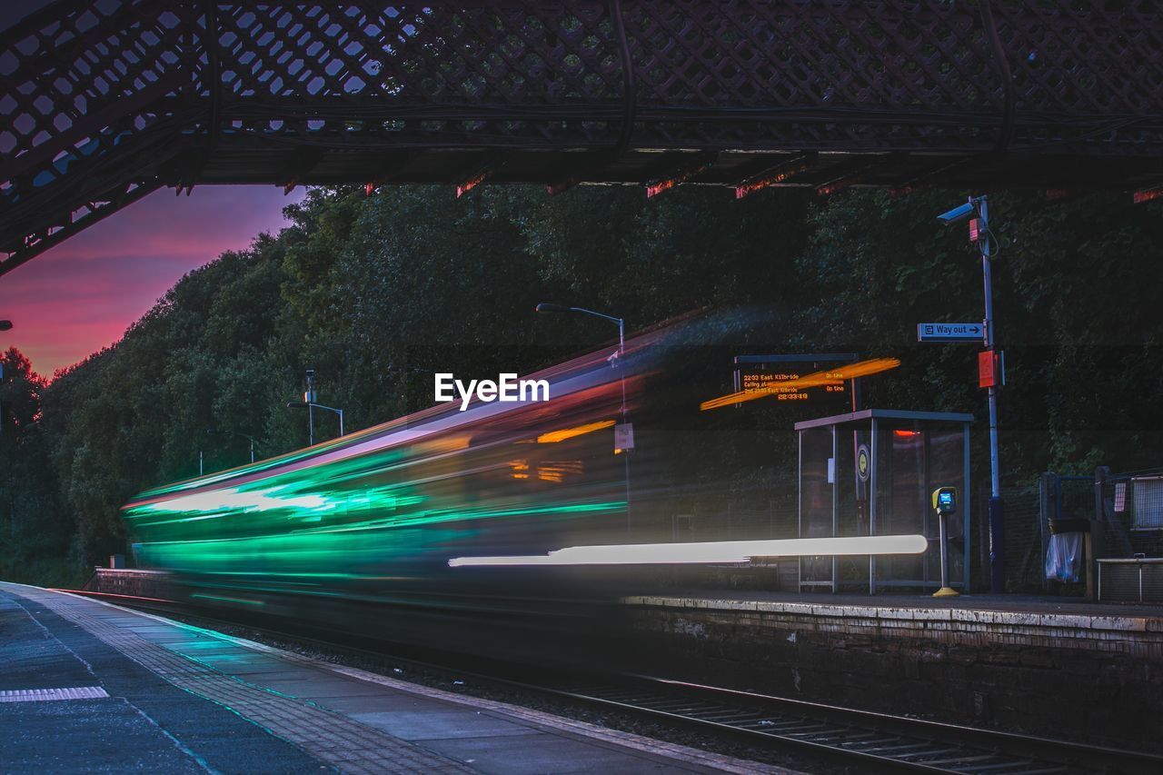 Blurred motion of train at railroad station