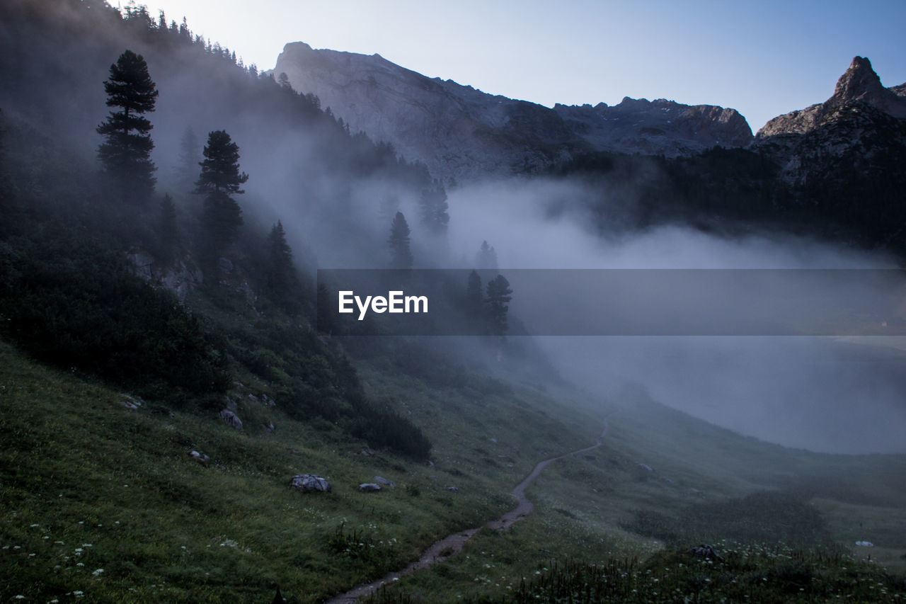 Scenic view of mountains during foggy weather
