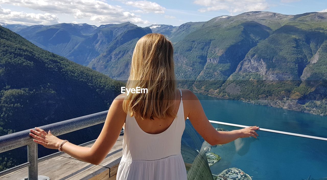 Rear view of woman looking at mountains